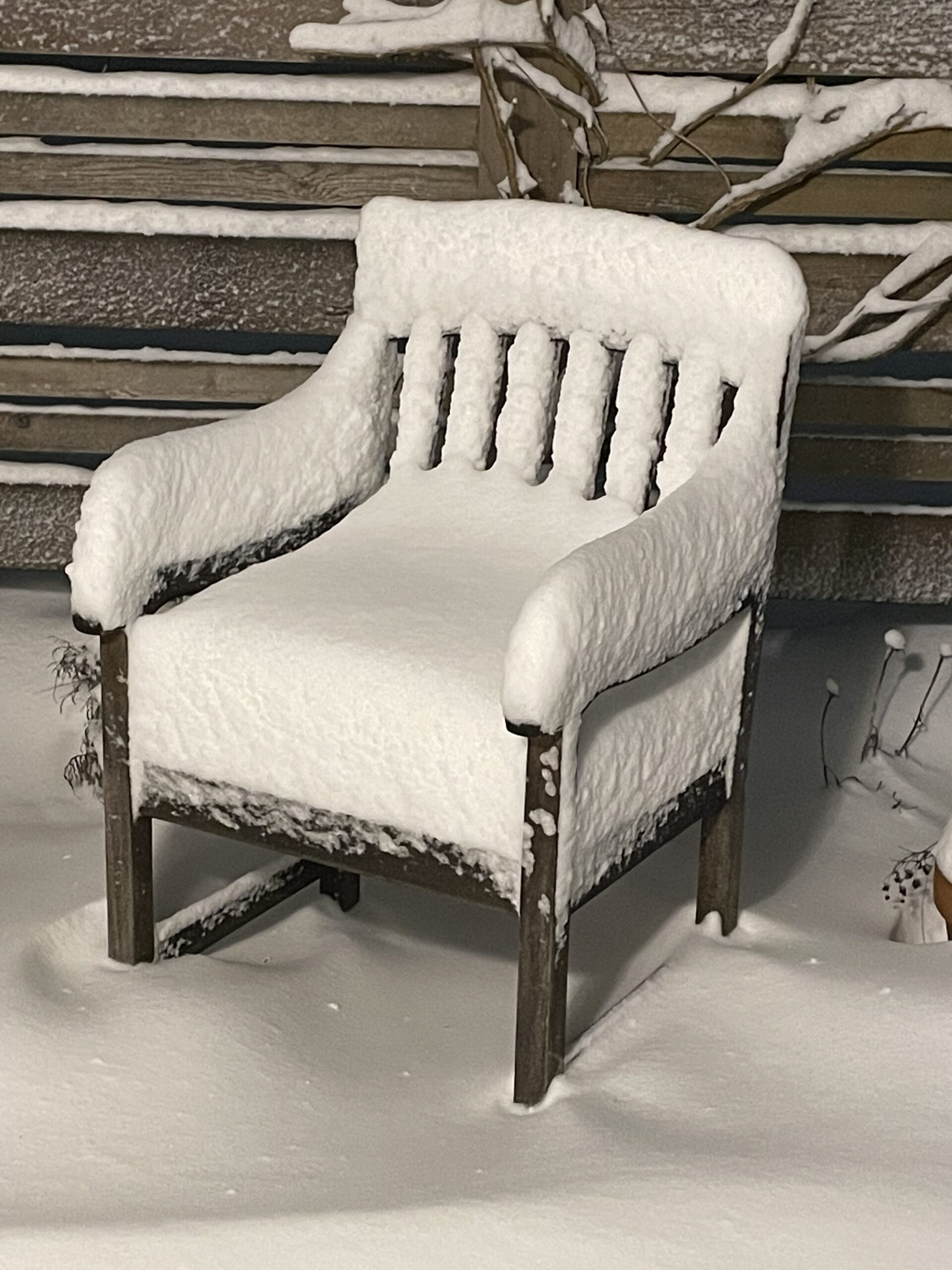 image of outside chair with about 10 inches of snow on it.